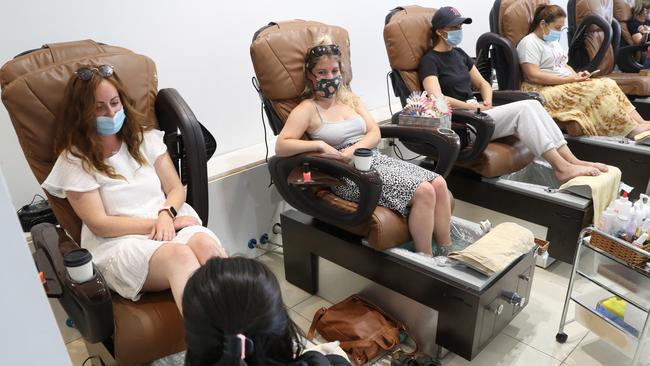 Melburnians celebrate a return to COVID-normal life, with beauty salons like this one in South Yarra back in business on Wednesday. Picture: NCA NewsWire/ David Crosling