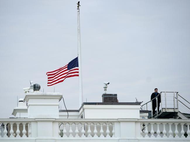 The flag above the White House flies at half staff after an order by US President Donald Trump. Picture: AFP