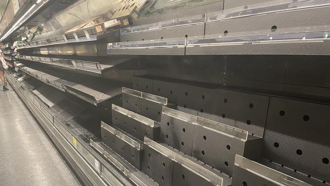 Empty shelves at the Woolworths store in Alice Springs as a result of flooding near Tennant Creek. The weather system caused widespread flooding and remote NT residents to be evacuated to Darwin from areas including Pigeon Hole and Kalkarindji. March 6, 2023. Picture: Laura Hooper