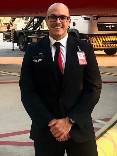 Qantas flight attendant Nathan Greaves previously worked in the travel industry but has taken up a job during COVID as a triple-0 calltaker. Picture: Supplied