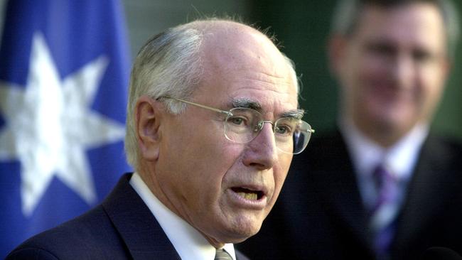 John Howard at a press conference on superannuation in 2004. Picture: Mark Graham