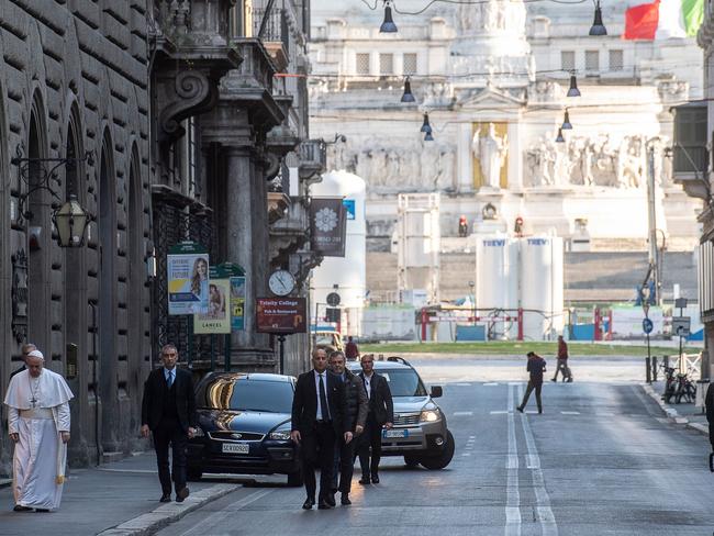 Pope Francis walking in an empty Via del Corso in Rome. Picture: Vatican Media/AFP