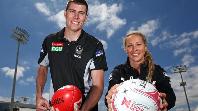 Recently re-signed ruckman/forward Mason Cox and Magpies' Super Netball recruit Erin Bell got back to work on Wednesday. Picture: Getty Images