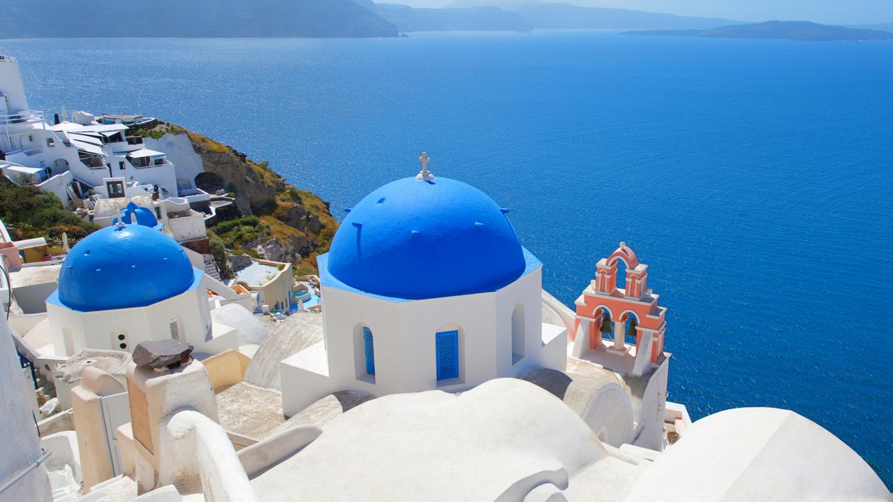 Santorini in Greece didn’t make the top five business travel destinations but it’s scorching hot among Australian holiday-makers looking for a mid-year break. Picture: Getty Images