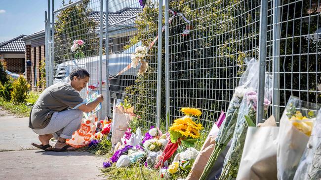 Floral tributes have been left at the scene of a tragic house fire in Werribee which killed four children. Picture: Jake Nowakowski