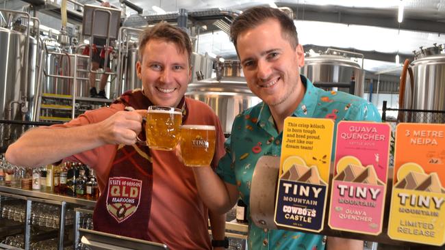 Tiny Mountain head brewer David Mullins and venue manager Tim Bennie with Four Point Pale Ale brewed for the State of Origin game in Townsville in 2021.