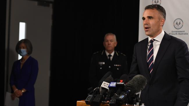 Premier Peter Malinauskas with Professor Nicola Spurrier and Police Commissioner Grant Stevens, announcing the end of isolation for close contacts at midnight on Saturday. Picture: Tricia Watkinson