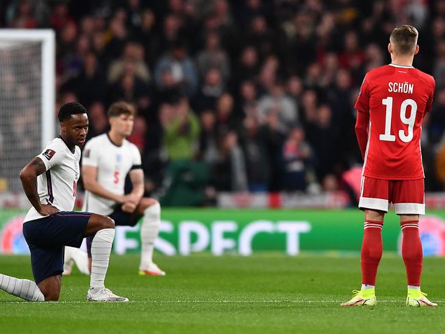 Violence, boos as England players take the knee