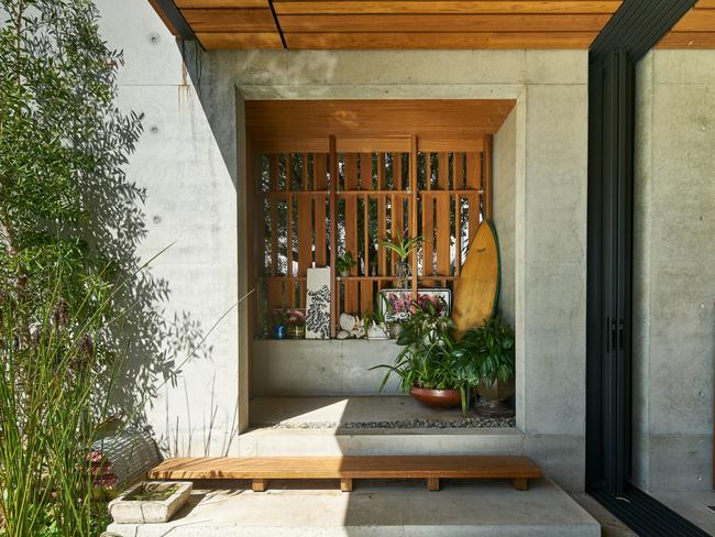 “Concrete was used deliberately so we could run the garden wall through the house and out the other side. It’s a durable material that will age gracefully.” Photographer: Alex Chomicz