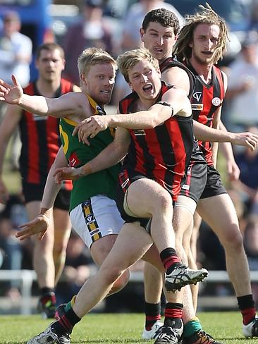 Gippsland Football League Grand Final match between Maffra Eagles and Leongatha Parrots. Maffra became the 2016 premiers, defeating Leongatha 13.10 (88) to 9. 16 (67). Jackson Scott gets a kick away from Patrick McGrath. Picture: Yuri Kouzmin