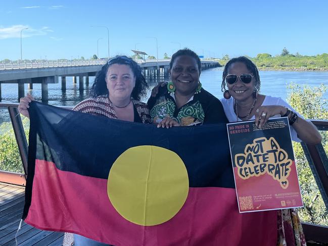 Mackay. The Survival Day Working Group gather at Blue Water Quay for Survival Day preparations. Picture: Survival Day Working Group with Indigenous Flag