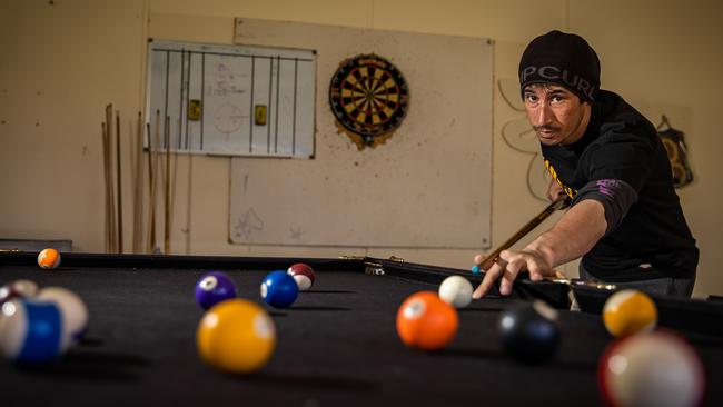 Anthony Pullen relaxes with a game of pool. Picture: Tom Huntley