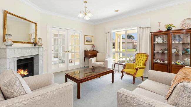 The formal loungeroom has a gas fire has its centrepiece.