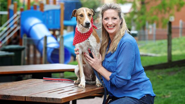 Liza-Jane Snowden with Taxi, a dog she rescued and brought to Tasmania after finding him in Vanuatu. Picture: LUKE BOWDEN