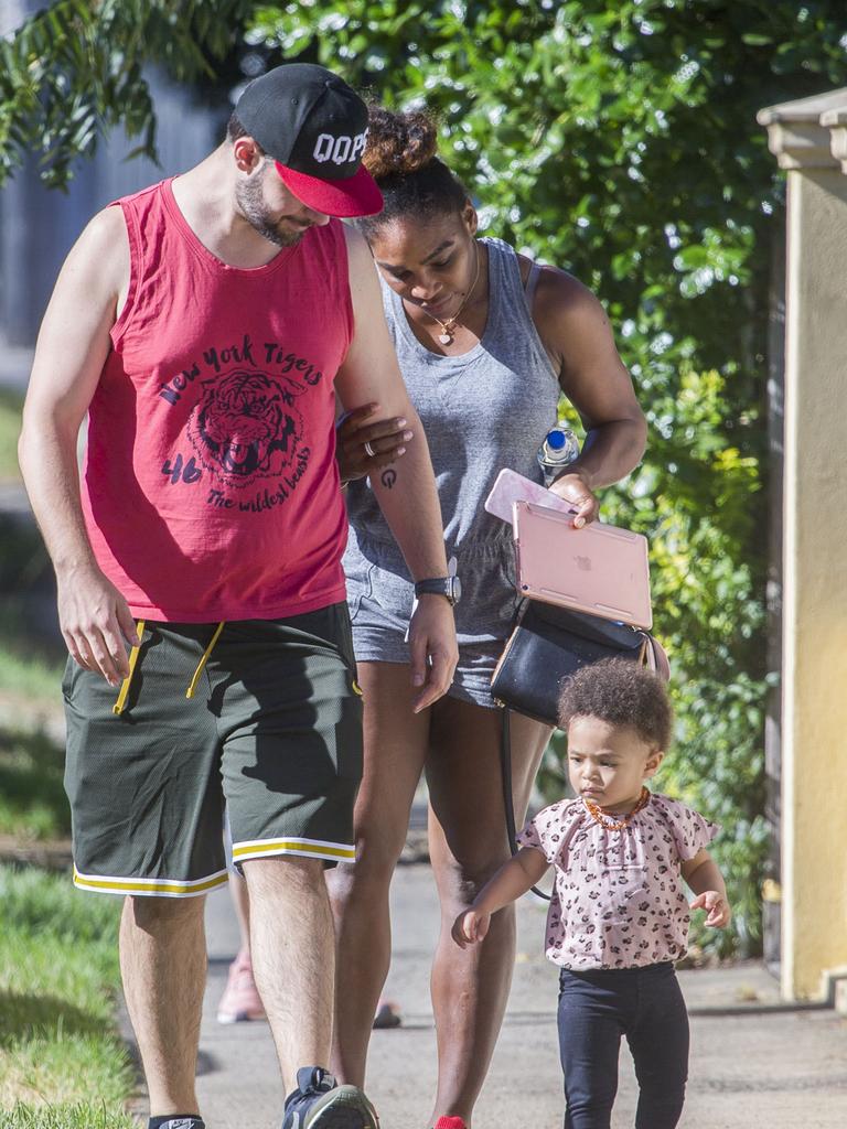 Serena Williams and her husband Alexis Ohanian enjoy an afternoon walk with their 1-year-old daughter Alexia Olympia. Serena's daughter looked seriously cute, toddling her way down the footpath, wearing Nike sneakers like her Mummy. Picture: MediaMode 