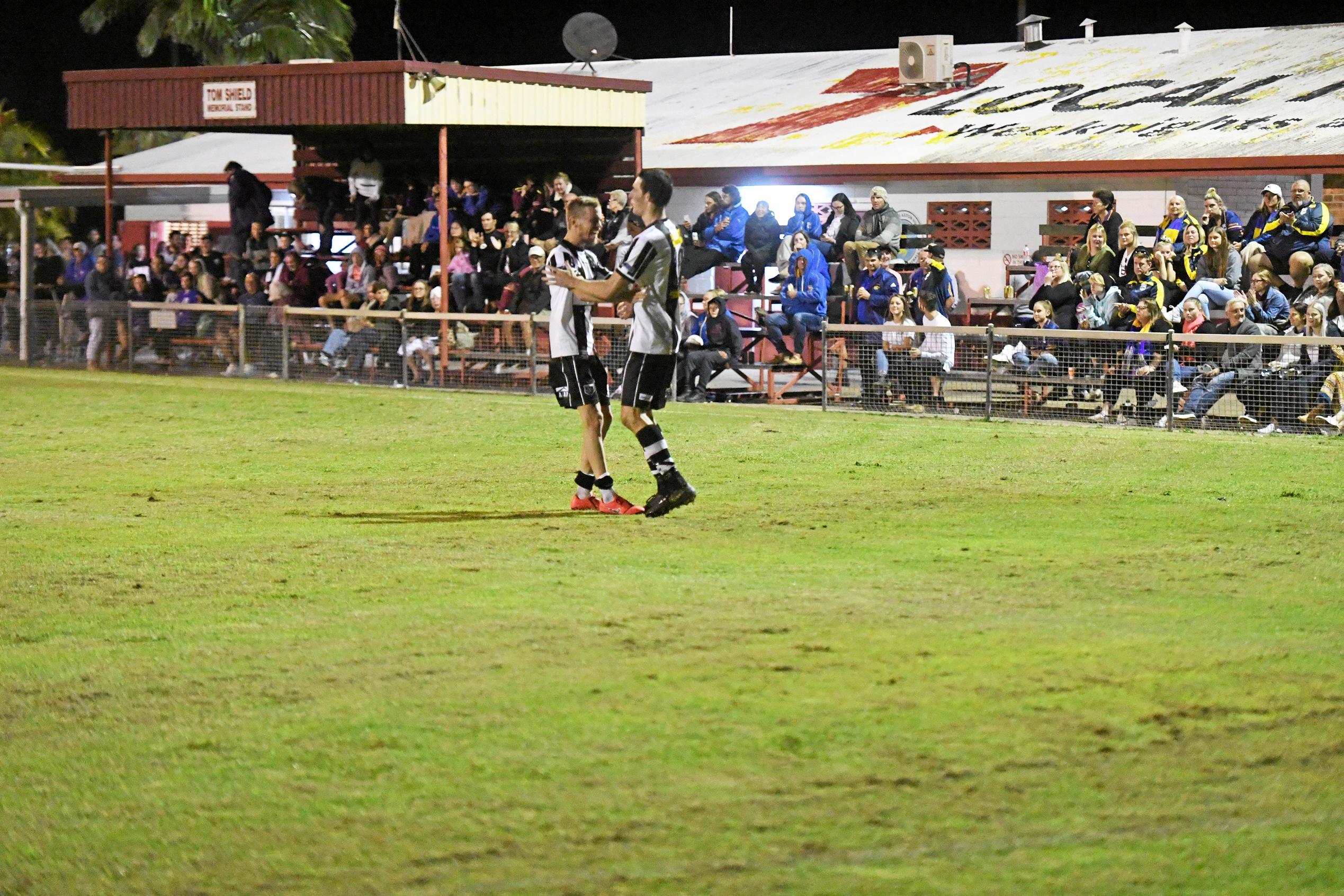 Bingera captain Daniel Watson celebrates with Joel Haack after he scored the winning penalty in the Triple M Division 1 cup final. Picture: Shane Jones