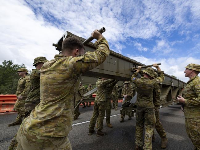 Australian Army soldiers setting up a temporary bridge at Ollera Creek, Townsville.