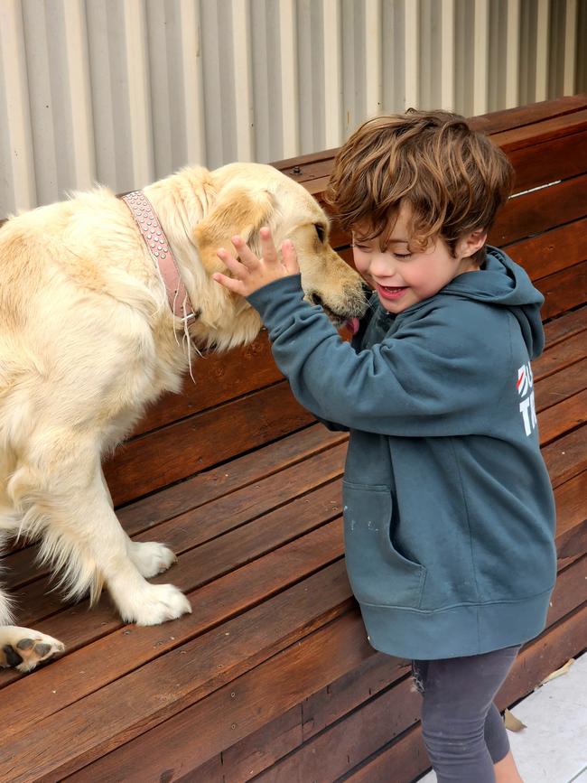 Koa Munro and his support dog Louie. Picture: Supplied