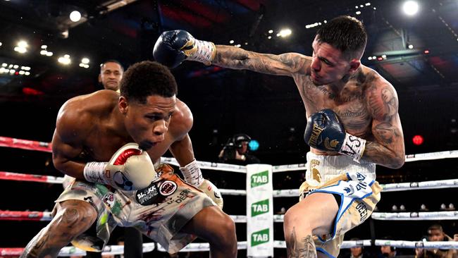 Devin Haney of the US (L) fights with Australia's George Kambosos (R) during their lightweight title boxing match in Melbourne. Picture: William West