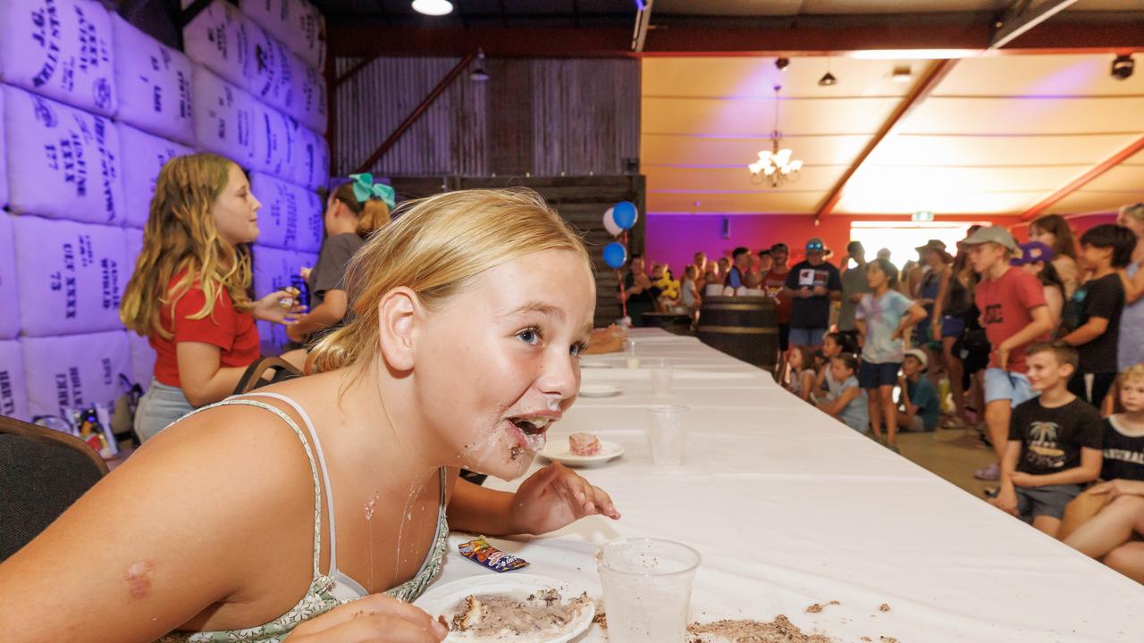 12 year old Maddie Wilkinson at the Lamington eating competition on Australia Day at the Banana Bender Pub on the Sunshine Coast. Picture Lachie Millard