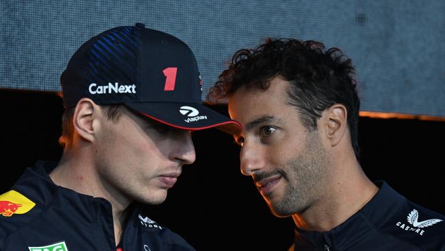 Daniel Ricciardo chats to Max Verstappen.