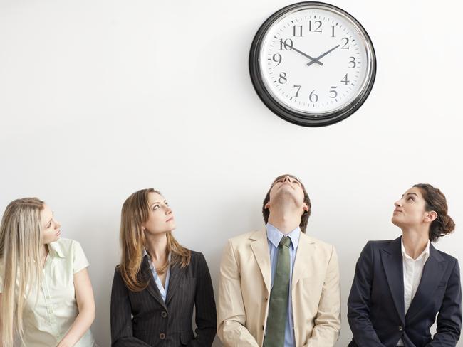 Four Business people with clock