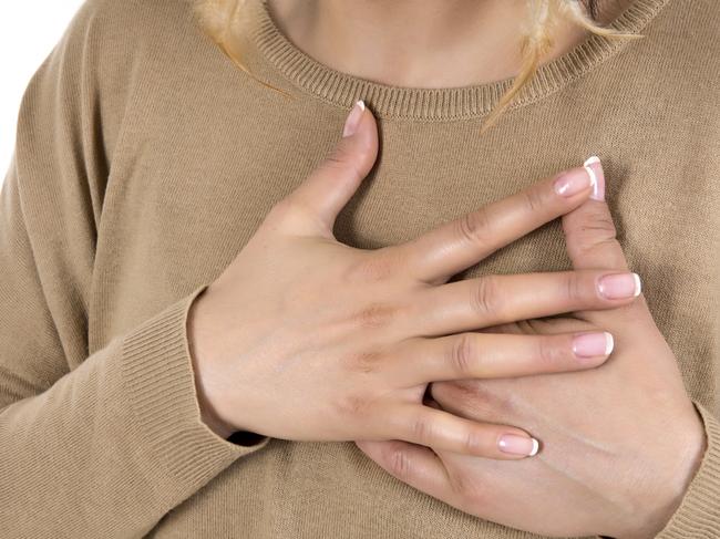 Generic photo of a woman having a heart attack - chest pains. Picture: iStock