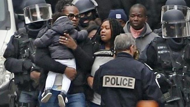 Police evacuate residents from buildings in Saint-Denis during the raids. Picture: Reuters.