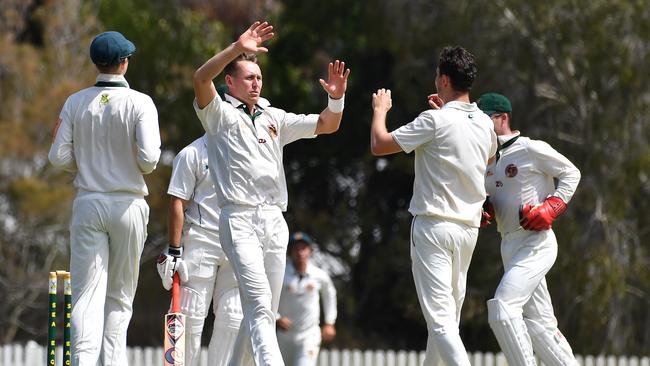 Redlands players celebrate a wicket in their latest first grade match against Wynnum Manly. Picture: John Gass