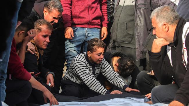 A child mourns the death of his family killed in an Israeli air strike. Picture: Getty Images