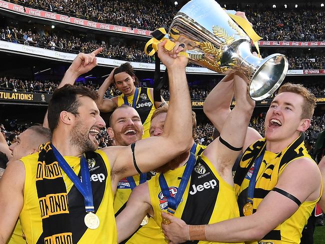 The Tigers with their premiership cup. Can Winx win her grand final, the WS Cox Plate? Picture: AAP