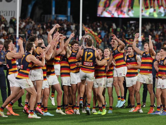 The Crows celebrate with the Showdown trophy. Picture: James Elsby/AFL Photos