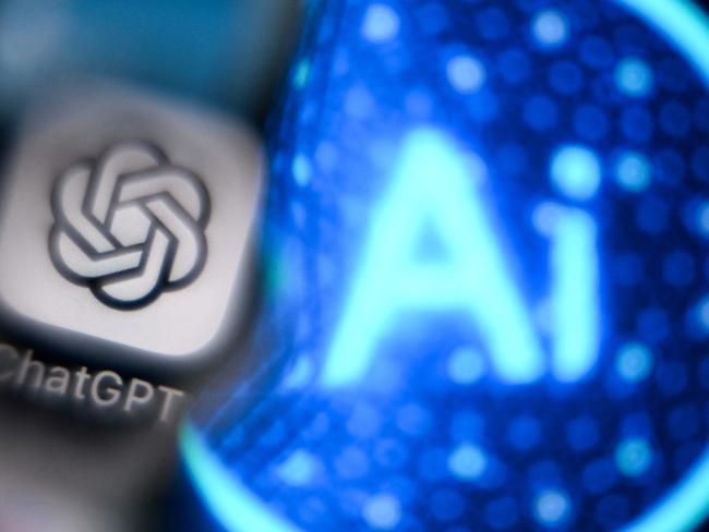 A photo taken on November 27, 2024 shows the logo of the ChatGPT application developed by US artificial intelligence research organization OpenAI on a smartphone screen (L) and the letters AI on a laptop screen in Frankfurt am Main, western Germany. (Photo by Kirill KUDRYAVTSEV / AFP)