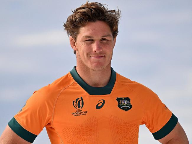 (FILES) Australiaâs Michael Hooper poses during the 2023 Rugby World Cup jersey launch media event in Sydney on June 22, 2023. Michael Hooper, who holds the record for the most caps as Australia captain, put an end to his international rugby career on June 30, 2024, after missing out on selection for the Paris Olympics.  The 32-year-old, who played 125 Tests for the Wallabies - 69 of them as skipper - announced his immediate retirement on social media. (Photo by Saeed KHAN / AFP) / -- IMAGE RESTRICTED TO EDITORIAL USE - STRICTLY NO COMMERCIAL USE --