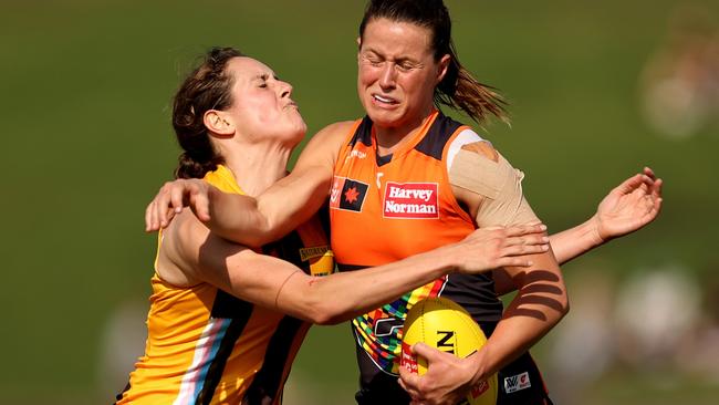 Nicola Barr fends off her Hawthorn rival at Henson Park, where facilities came under attack. Picture: Brendon Thorne/Getty Images