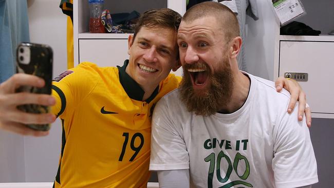 Craig Goodwin and Andrew Redmayne soak up their incredible penalty shootout triumph. Picture: Mohamed Farag/Getty Images