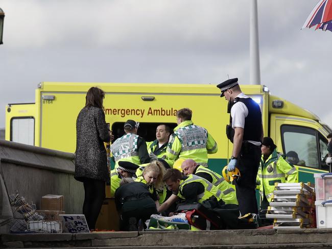 Nearly 70 London ambulance service workers were on scene within minutes. Picture: AP Photo/Matt Dunham.