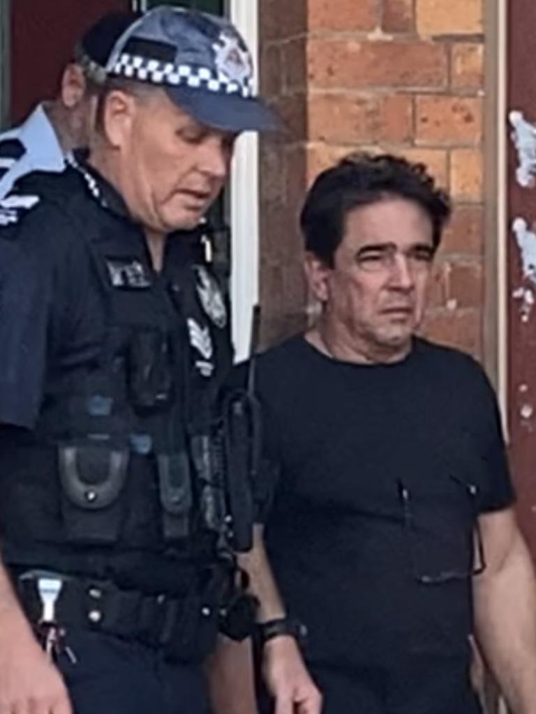 Karoly Palaga (right) is escorted from Gympie District Court on Tuesday August 22, 2023, after pleading guilty to two counts of producing dangerous drugs in excess of 500g, and one count of possessing items used in relation to drugs.