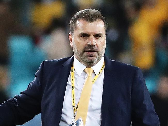 Socceroos coach Ange Postecoglou celebrates with Socceroos Tim Cahill after full time in the Socceroos v Syria World Cup Qualifier at ANZ Stadium, Sydney. Picture: Brett Costello