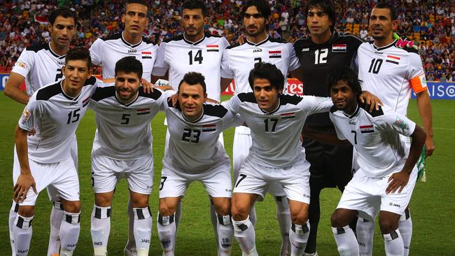 Iraq's team poses before the first round Asian Cup football match between Japan and Iraq.
