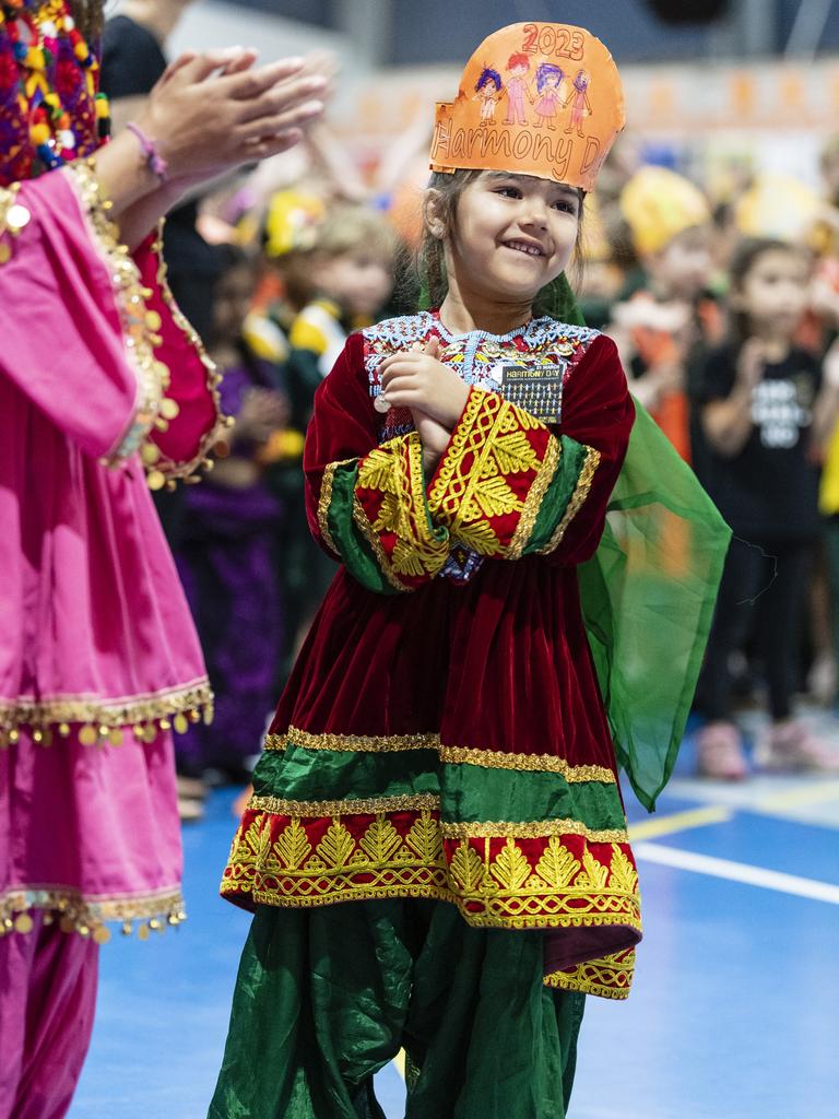 Emma Ahmadi stands with fellow students of the Afghanistan community during Harmony Day celebrations at Darling Heights State School. Picture: Kevin Farmer