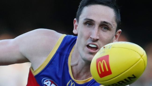 ADELAIDE, AUSTRALIA - MARCH 18: Dan Houston of the Power and Oscar McInerney of the Lions during the 2023 AFL Round 01 match between the Port Adelaide Power and the Brisbane Lions at Adelaide Oval on March 18, 2023 in Adelaide, Australia. (Photo by Sarah Reed/AFL Photos via Getty Images)