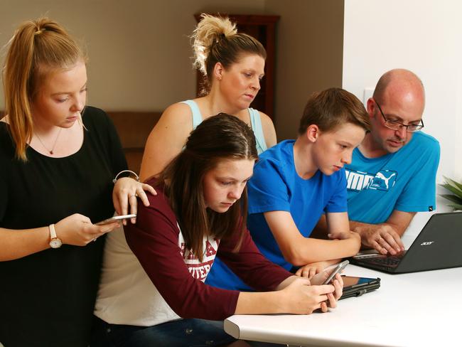 Neil and Leanne Dallimore, with children Chloe, 17, Abbey, 14 and Andrew, 12, from Blue Haven, are disappointed with the speed of their $120 per month NBN broadband internet package. Picture:Peter Clark