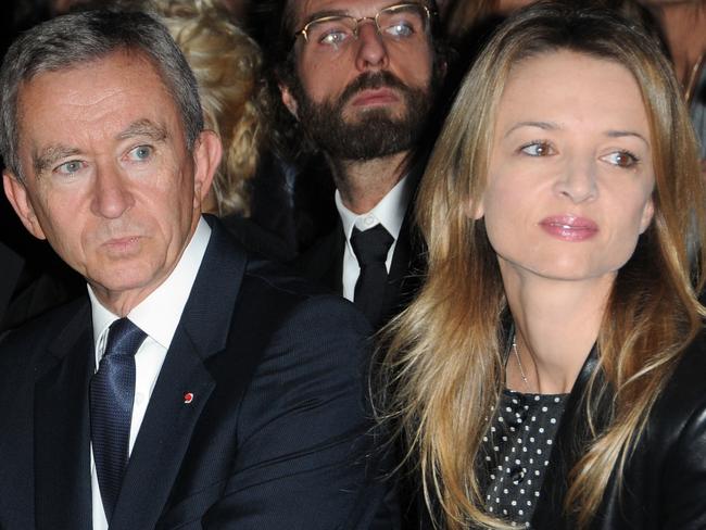 PARIS - OCTOBER 07:  (L-R) Helene Arnault, Bernard Arnault and Delphine Arnault attend the Louis Vuitton Pret a Porter show as part of the Paris Womenswear Fashion Week Spring/Summer 2010 at Cour Carree du Louvre on October 7, 2009 in Paris, France.  (Photo by Pascal Le Segretain/Getty Images)