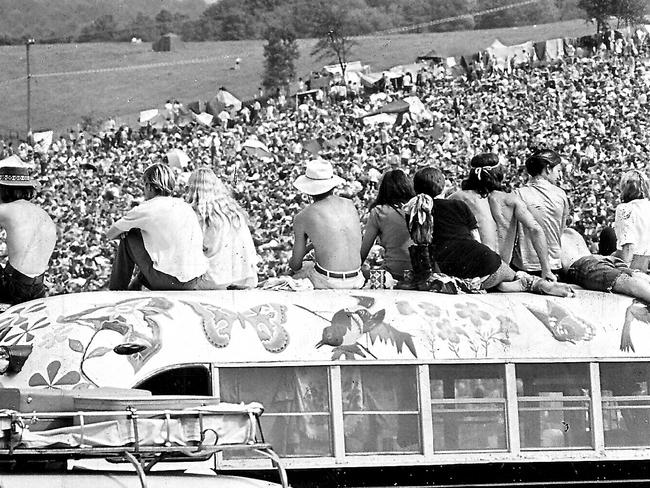 Crowd at 1969 Woodstock rock music festival at farm of Max Yasgur at Bethel, New York, USA.