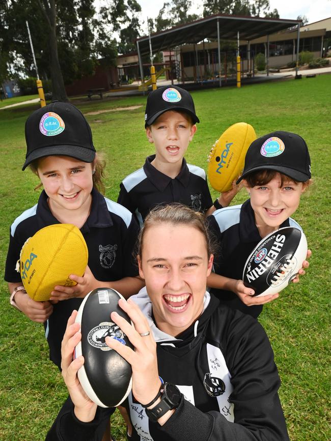 Collingwood AFLW player Jordyn Allen with Shepparton East Primary School students, from left Lexi, Alex and Allegra. Picture: Rob Leeson