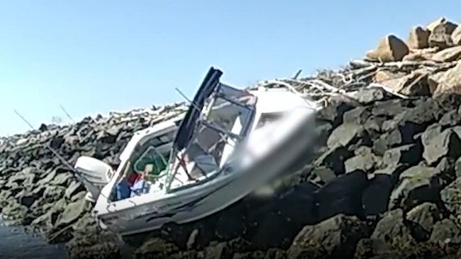 Boat on rocks at Port of Brisbane