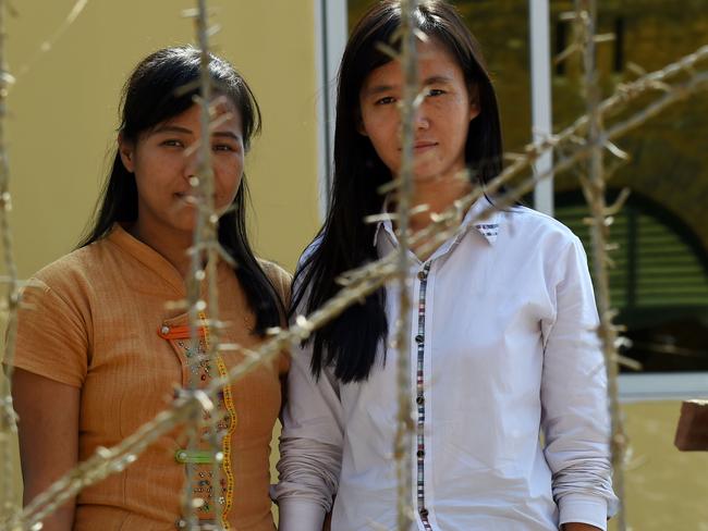 To be free ... Detained Myanmar students Honey Oo, 28, (L) graduating law student and Phyo Phyo Aung, 27, (R) third year in civil engineering, are among some 40 students under detention for protesting. Picture: AFP