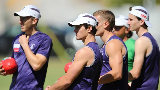 Lachlan Schultz, middle, watches on at his first training session as a Docker.