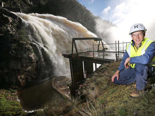 Hydro Tasmania Dam Safety Manager Chris Topham at the flowing spillway (150 cubic metres per second) of the Cethana Dam